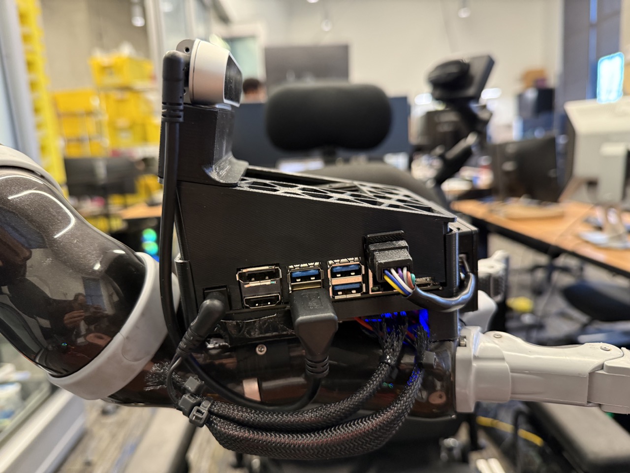 
                    This image shows the right-view of the robot arm's 6th joint, with
                    the arm mount screwed into it. A red circle highlights the screw on
                    this side of the arm mount.
                    