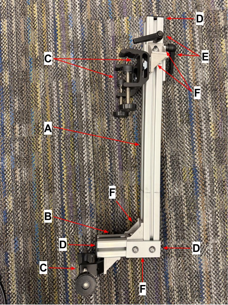 
                    The hospital table mount in isolation, with letters corresponding
                    to the items in the parts list.
                    