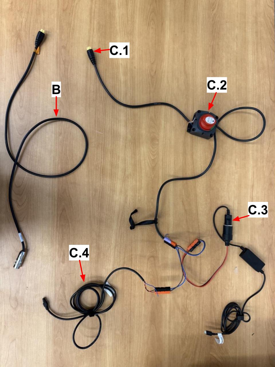 
                    The cables and adapters used to power the robot, laptop, and router from the power wheelchair.
                    